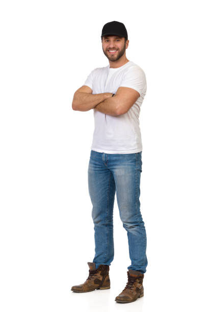 istock Handsome Man Wearing Black Cap Is Standing With Arms Crossed And Smiling 1289699744