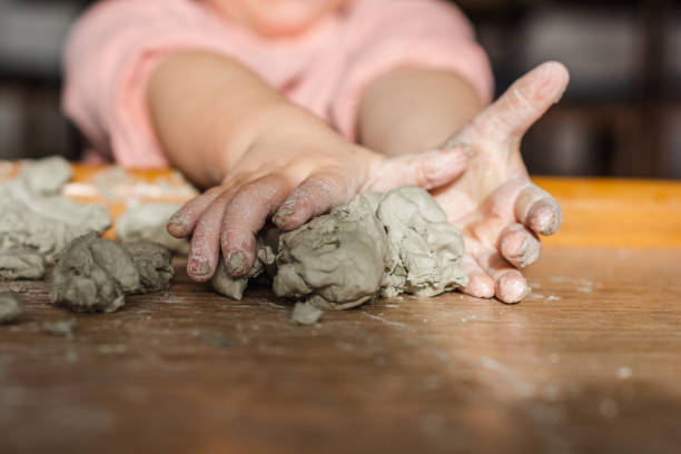 istock Children hands molding toy clay at home 1289700646