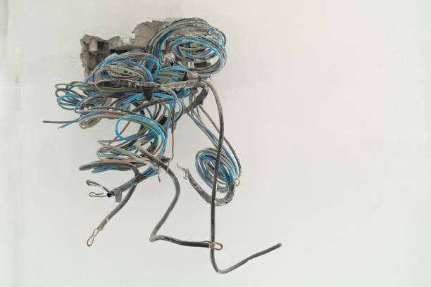 istock Electrical box and power wires in concrete wall 1289702176