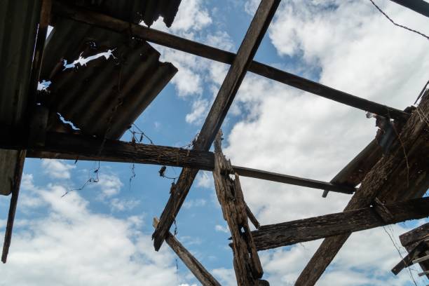 istock Old damage roof with blue sky and clouds images 1289702266