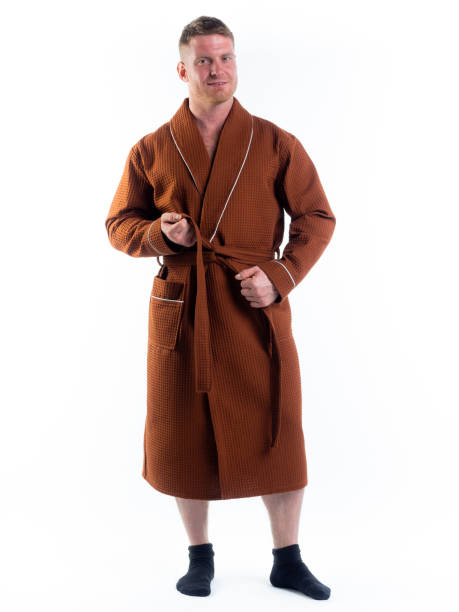 istock strong man in a Bathrobe on an isolated white background with a smile on his face. 1289703723