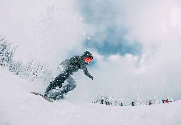 snowboarder jumps with snow dust - slalom skiing imagens e fotografias de stock