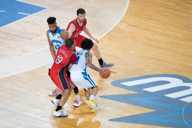 istock Basketball players chasing for ball 1289707376