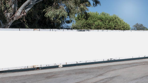 istock Long empty white hoarding with mock up place at city street. 1289707538