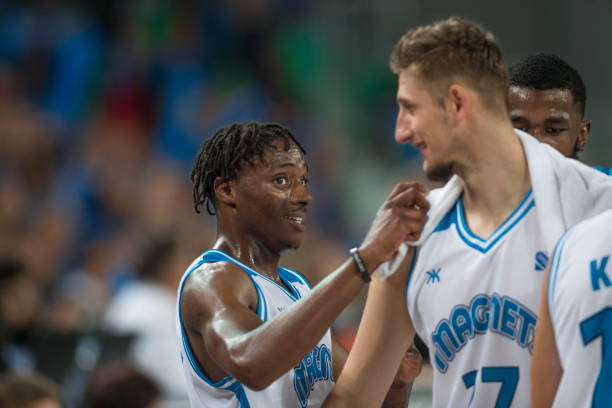 istock Basketball players in court 1289707562