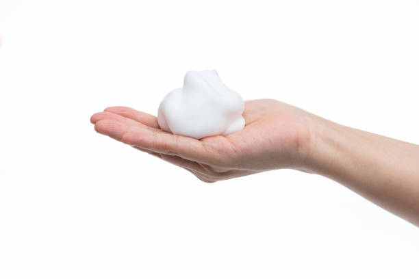 istock Foam bubble on woman hand 1289708347
