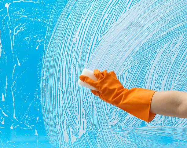 istock Cleaning glass window with sponge 1289709878