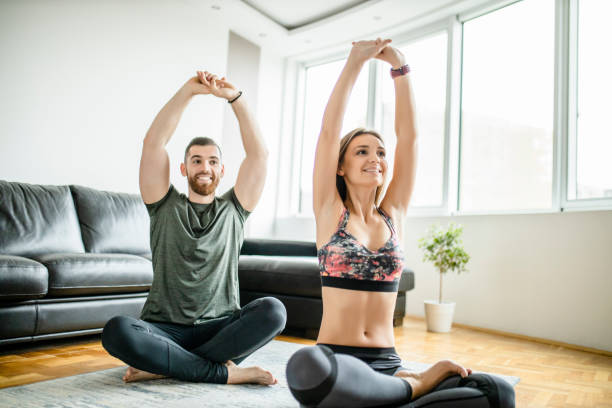 istock Couple stretching after intensive home workout 1289711036