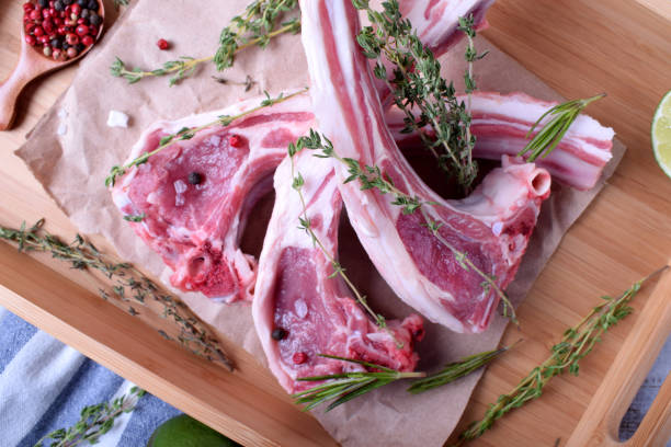 istock Raw lamb ribs, spices and herbs on parchment 1289711278