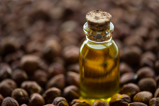 Hazelnut oil in small glass bottle.