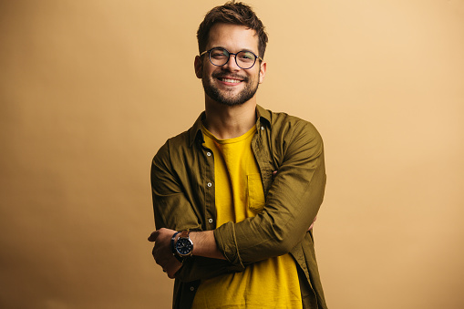 Young adult confident male standing and smiling