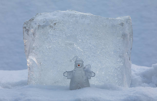 istock christmas ice snowman in the snow 1289717112