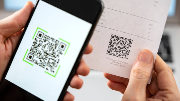 Scanning QR code with mobile phone Scanning QR code with mobile phone bar code reader stock pictures, royalty-free photos & images
