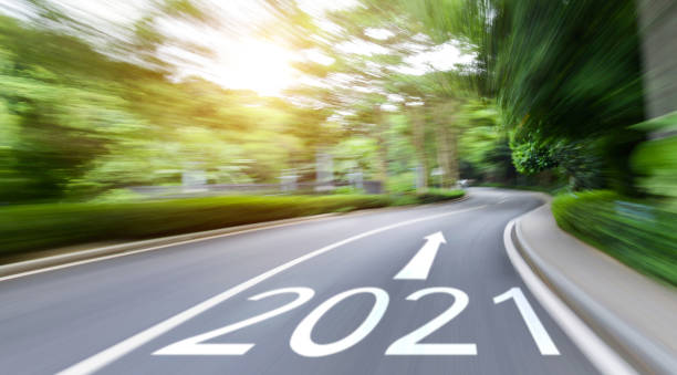 istock Empty asphalt road with Number 2021 in motion blur 1289724516