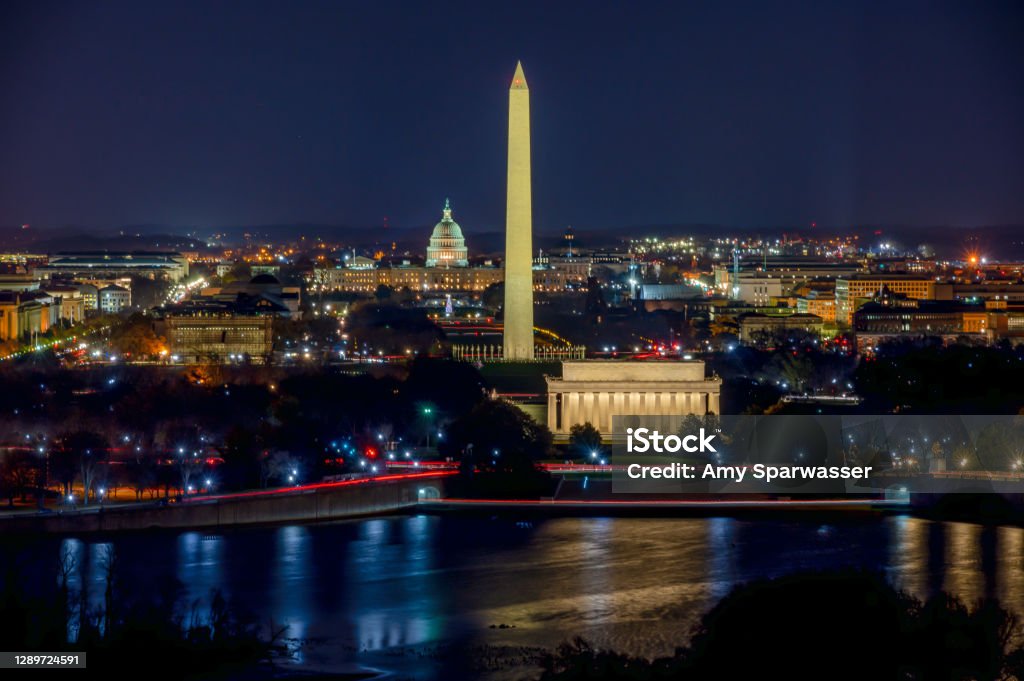 Aerial View of the Washington DC at night Long Exposure picture of illuminated Washington DC at night with the US. Capitol, Washington Monument and the Lincoln Memorial visible Washington DC Stock Photo