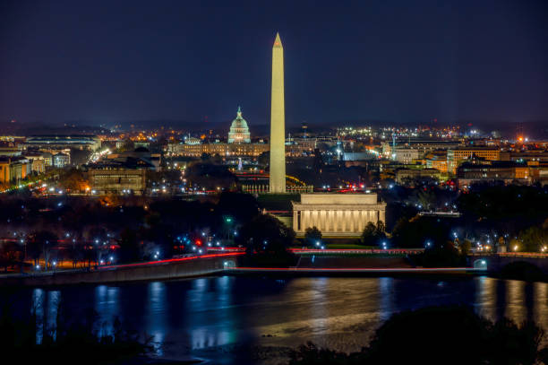 Aerial View of the Washington DC at night Long Exposure picture of illuminated Washington DC at night with the US. Capitol, Washington Monument and the Lincoln Memorial visible potomac river photos stock pictures, royalty-free photos & images
