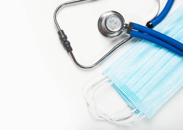 istock Medical white banner with stethoscope and face masks 1289724645
