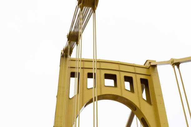 istock Support structure of a self-anchored suspension bridge, grey sky copy space 1289726629