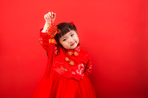 A girl celebrates Chinese New Year with a Chinese knot