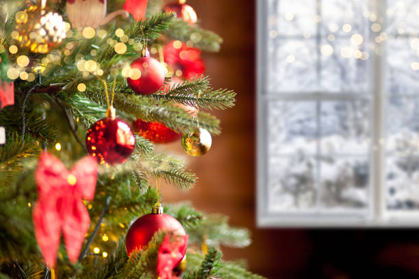 istock Decorated Christmas tree with window on the background. 1289732929