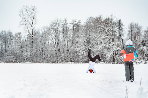 istock Two playful girls in a snowy nature 1289733608