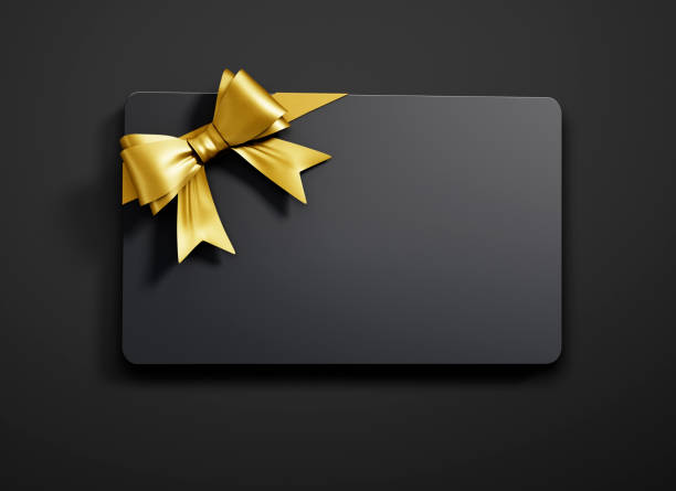 Gift Card with tied Bow Black Gift Card with golden Bow on dark Background tied knot photos stock pictures, royalty-free photos & images