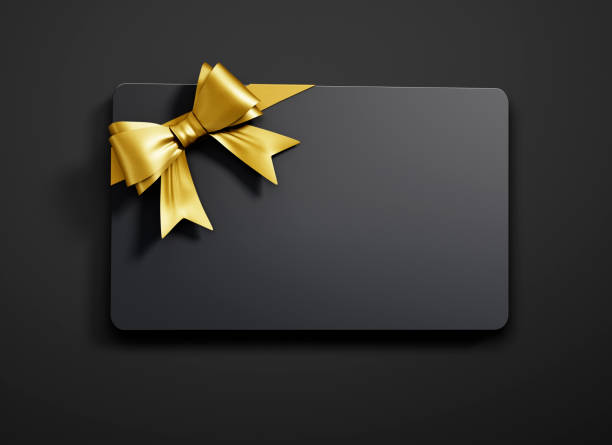 Gift Card with tied Bow Black Gift Card with golden Bow on dark Background gift card template stock pictures, royalty-free photos & images