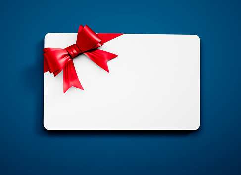 White Gift Card with red Bow on blue Background