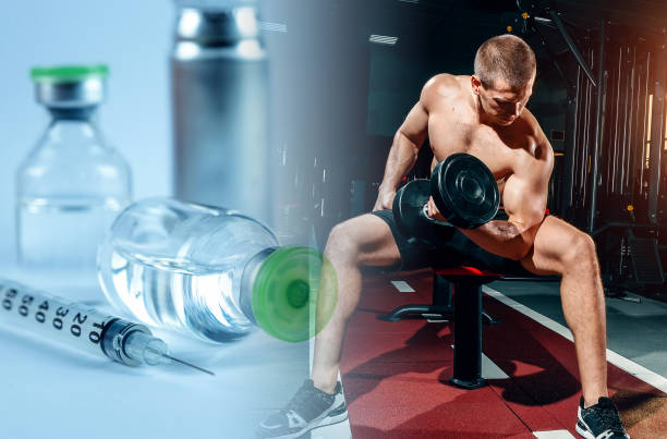 istock Bodybuilder in the gym, injecting a steroid syringe. Strong athletic muscular man, workout, fitness and bodybuilding. Healthy and unhealthy supplements to increase muscle mass. 1289736282