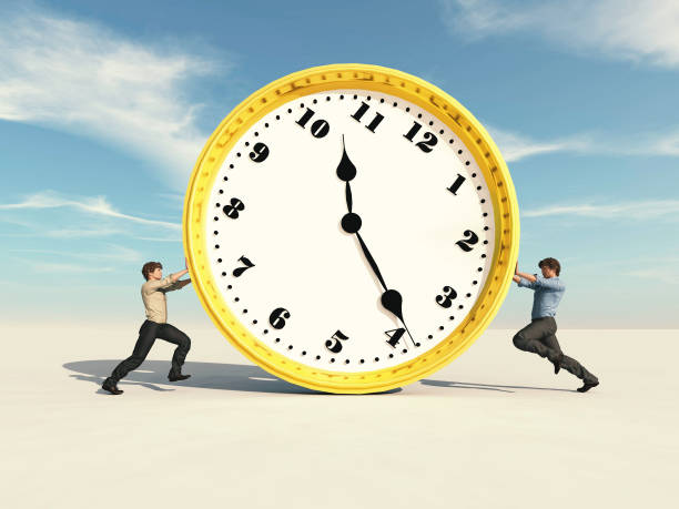 istock Two men pushing a clock against eachother . Struggling with deadlines . This is a 3d render illustration . 1289737196
