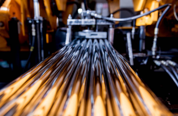 istock Automatic band saw machine with water coolant cutting metal pipes. 1289737263