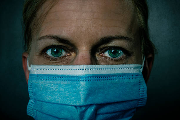 istock young woman wearing protective face mask 1289740315