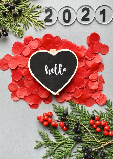 istock Hello 2021. New year flatlay with 2021 numbers on red confetti 1289741822