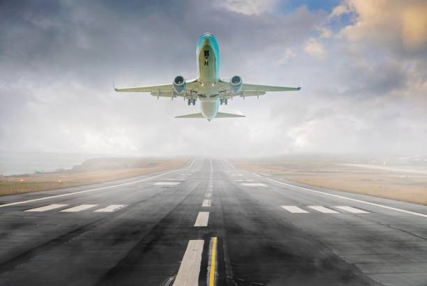 istock Passenger airplane taking off at fog. 1289741841