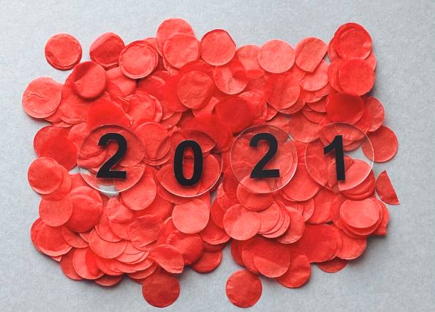 istock Christmas red confetti. Happy new year 2021 1289742665