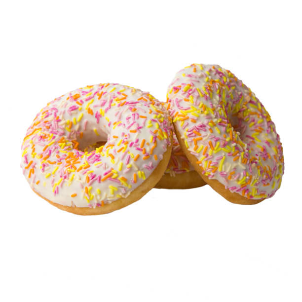istock Sweet donuts with color glaze isolated on white background. 1289744331