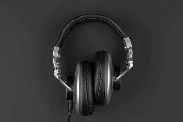 istock Professional headphones with wire on a dark background. 1289745351
