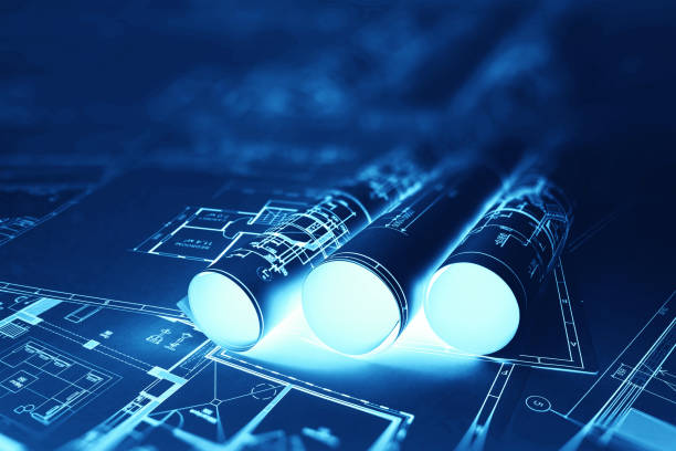 istock Blue-white construction drawings on the table. The concept of construction, architecture, design, business 1289745910