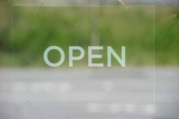 istock Open sign on green and gray background 1289746047