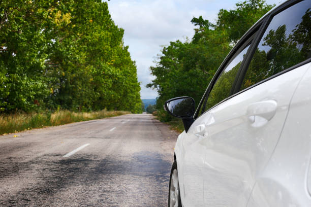 istock Traveling by white car on the road. 1289747481