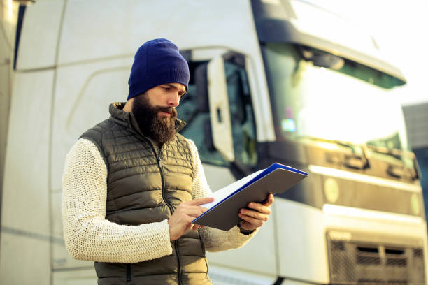istock Truck driver finishing an order 1289749256