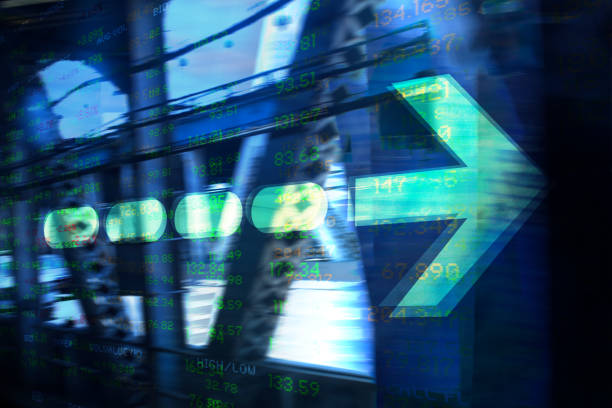istock Finance. Arrow. New York Office Buildings and Trading Screen Data. 1289749271