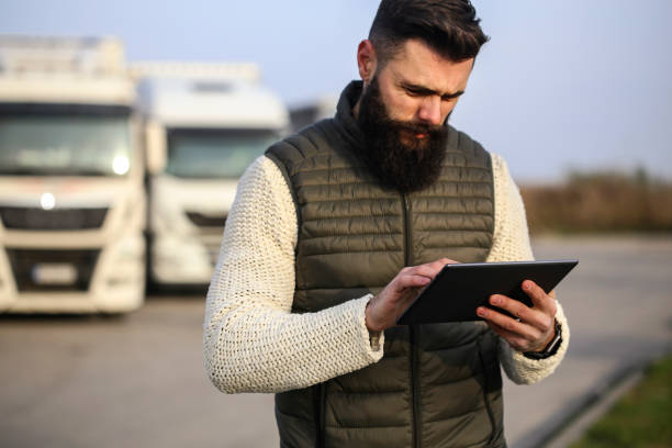 istock Truck driver finishing an order 1289750007