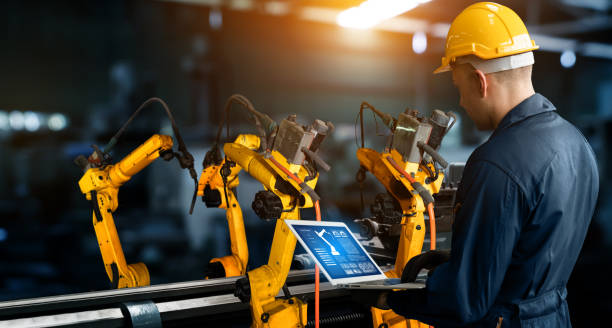 istock Smart industry robot arms for digital factory production technology 1289750571