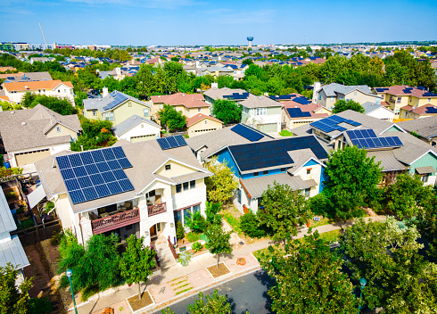 Aerial drone view of the Mueller District in Austin , Texas , USA - endless solar panels and a renewable , sustainable community of homes