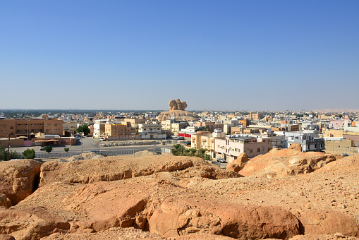 Al-Qarah, Al-Hofuf, Al-Ahsa Oasis, Eastern Province, Saudi Arabia: town skyline and Hill of the Heads - Ras Al-Qarah mount, view from the top of the Al-Qarah mountain, UNESCO world heritage site.