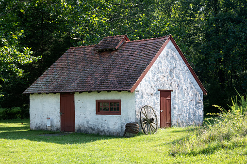 Cokato Township, Minnesota, USA - July 25, 2023: Landscape view of the The Barberg–Selvälä–Salmonson Sauna building, the oldest surviving savusauna (smoke sauna) in Minnesota. Named for the original owners, it has been relocated to Temperance Corner in Cokato, at the site of one of Minnesota’s first Finnish immigrant settlements.