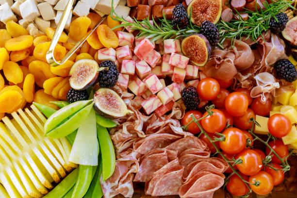 istock Close up of charcuterie board with cheese, fig, and crackers. 1289755883