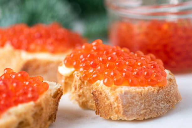 istock Christmas, New Year appetizer canape with red caviar 1289755941