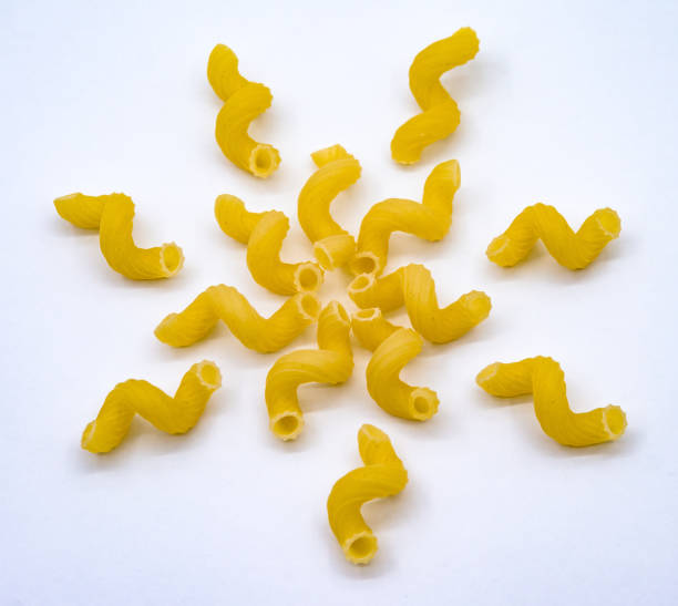 istock swirls of macaroni on a white background, spiral macaroni, macaroni patterns 1289757297
